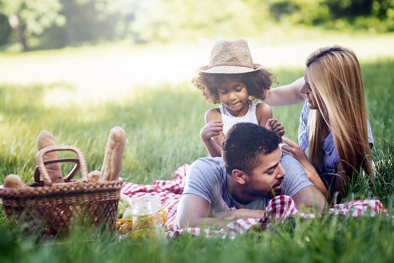 family picnicking outdoors