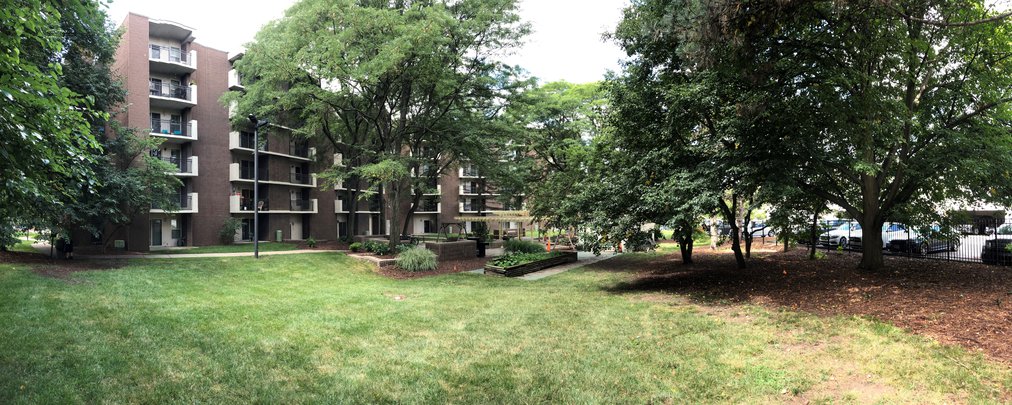 friendship manor building with lots of green grass in the front